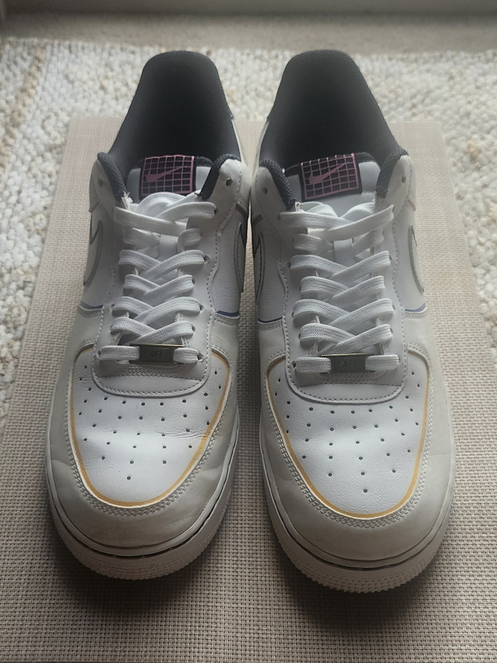 Nike White Sneakers with Gold Accent and Black Lining